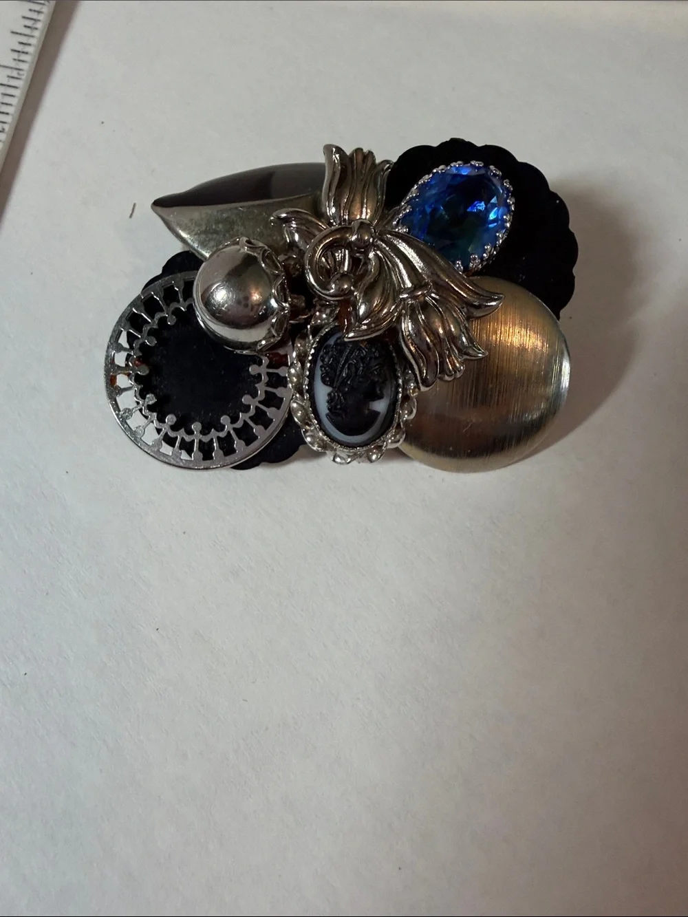 Vintage-Inspired Black and Silver Brooch with Blue Crystal Accent one of a kind